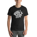 Unisex graphic T-shirt with "Don't Lose Hope" motivational design in Arabic and English.